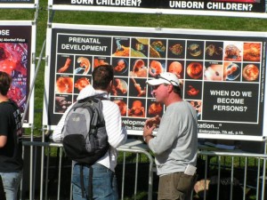Bubba Gene Garrett explains prenatal development to a student at James Madison University